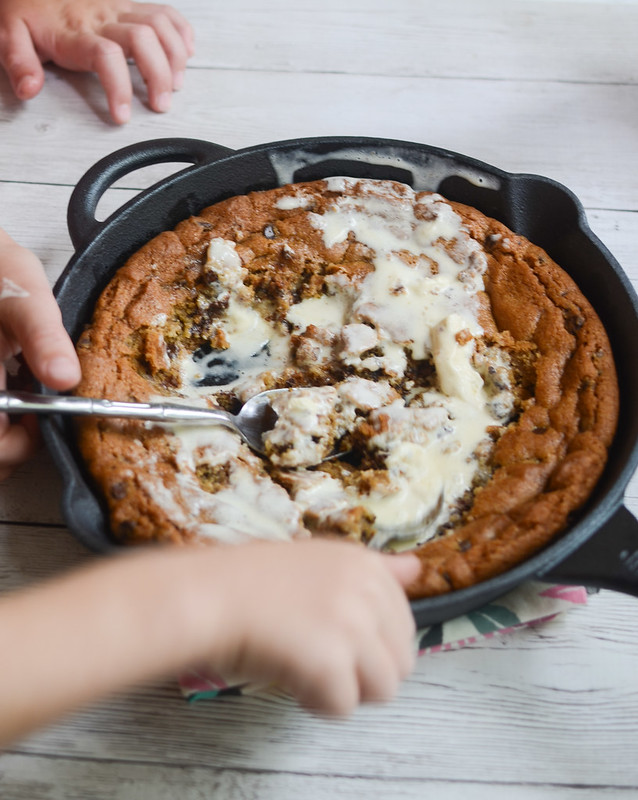 Chocolate Chip Pizookie - chocolate chip cookie dough baked in a skillet and topped with vanilla ice cream! Just serve it in the skillet and let everyone dig in! 