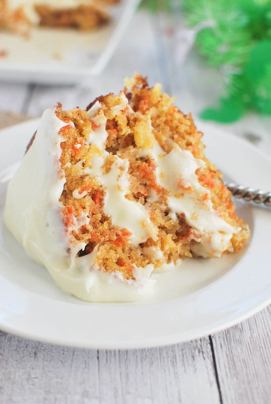 Carrot Cake with Buttermilk Glaze - delicious carrot cake with pineapple, coconut, and nuts! It's drizzled with a buttermilk glaze and topped with cream cheese frosting! 