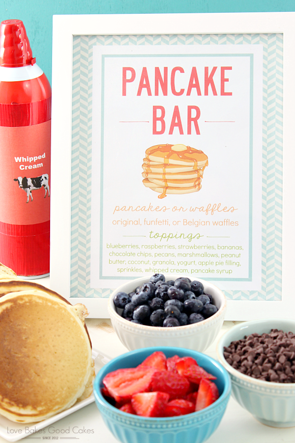 Pancake bar recipe with bowls of fresh fruit.
