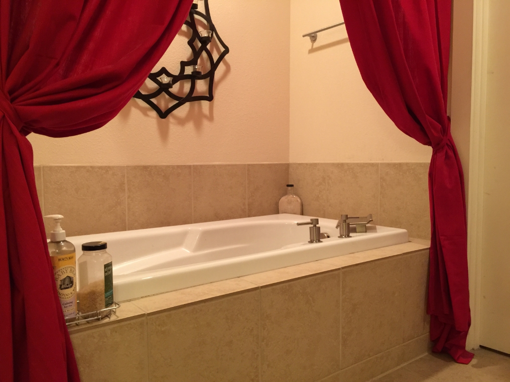 Luxury bathtub styling with red curtain