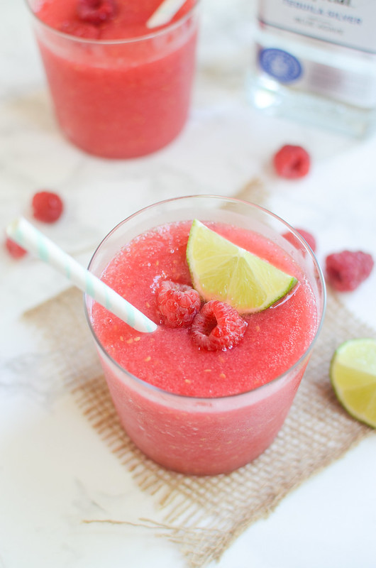 Frozen Raspberry Margaritas - an easy 4 ingredient recipe for the perfect poolside drink! Fresh or frozen raspberries are blended with tequila, orange liqueur, and fresh lime juice. 