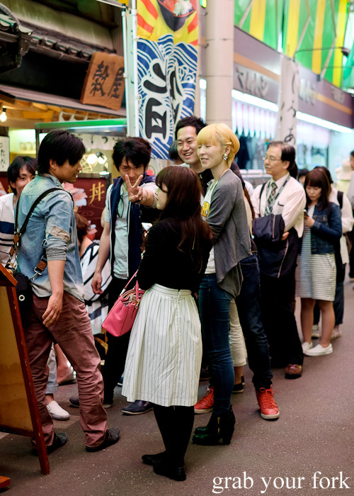 Queuing customers at Uouma inside Omicho Market, Kanazawa, Japan