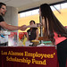 Española High School graduate and Silver Scholar recipient Evelyn Juarez (right) chats with Lab employees.