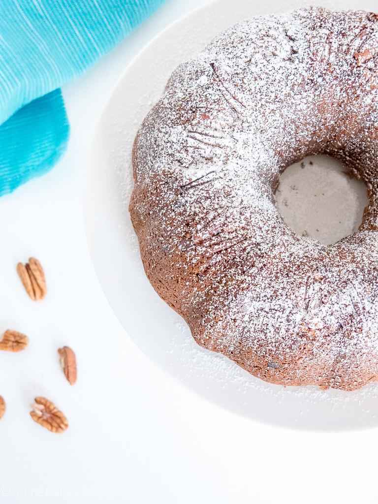 top view of chocolate pecan bundt cake with powdered sugar