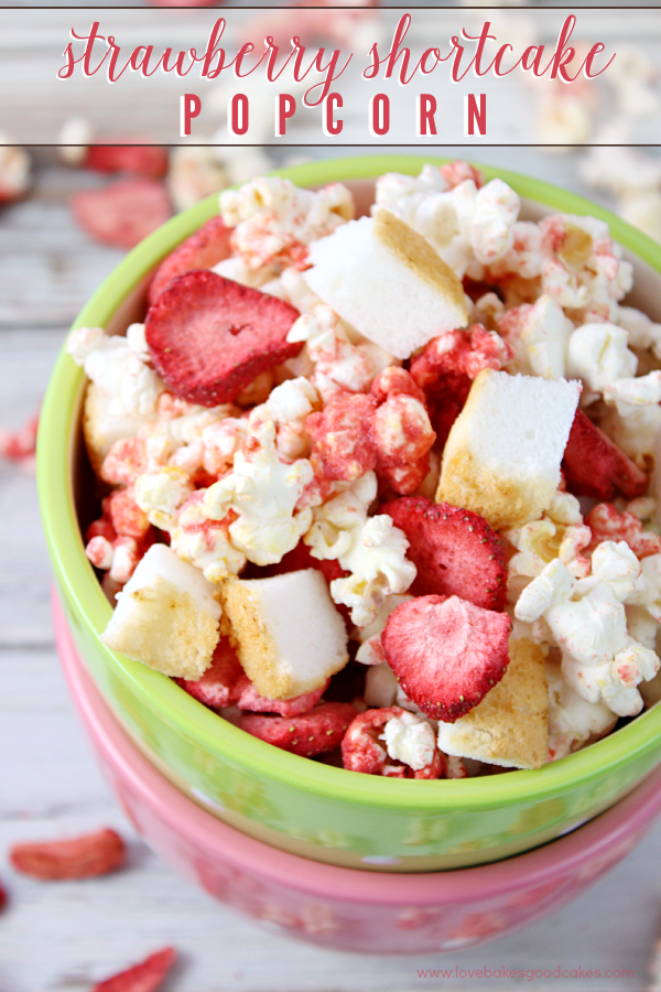 Strawberry Shortcake Popcorn in a stack of bowls.