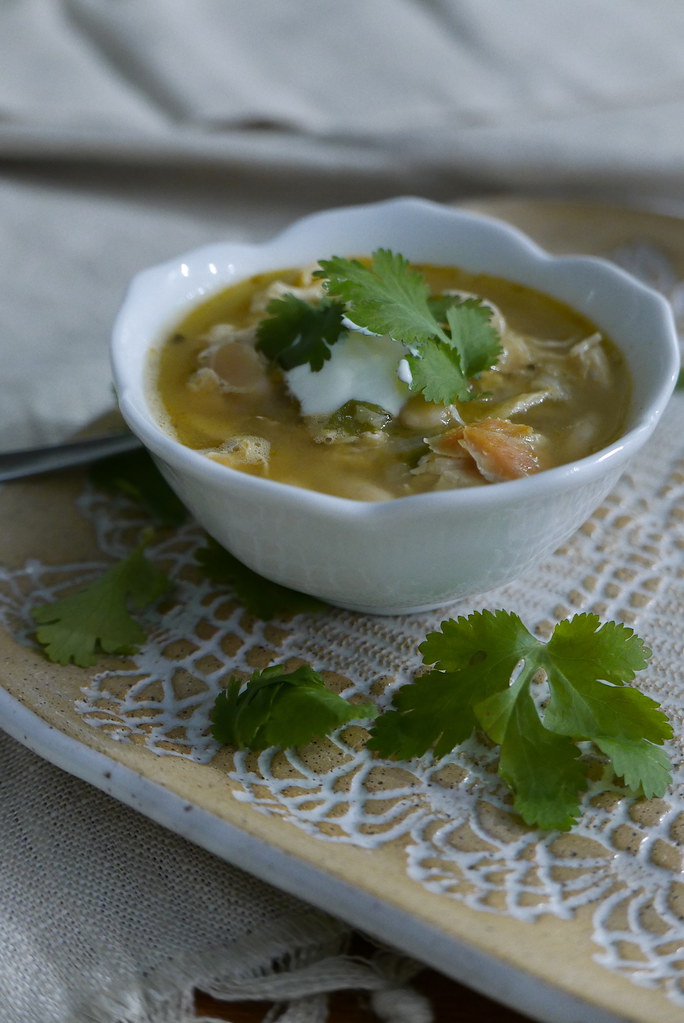 The perfect bowl of White Chicken Chili topped with sour cream and cilantro.