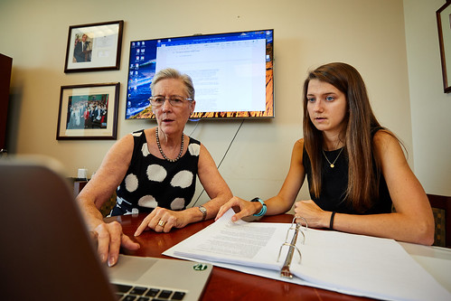 Dr. Cynthia Tifft and Cassie Bebout sitting at a desk