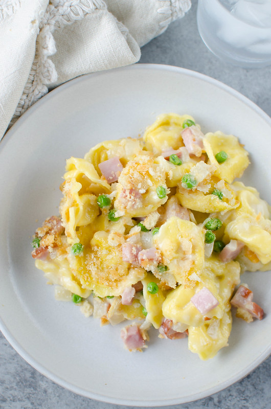 Cheesy Ham and Tortellini Bake - cheese-filled pasta with ham and peas in a creamy, cheesy sauce with a Ritz cracker topping! An easy 30 minute meal the whole family will love!