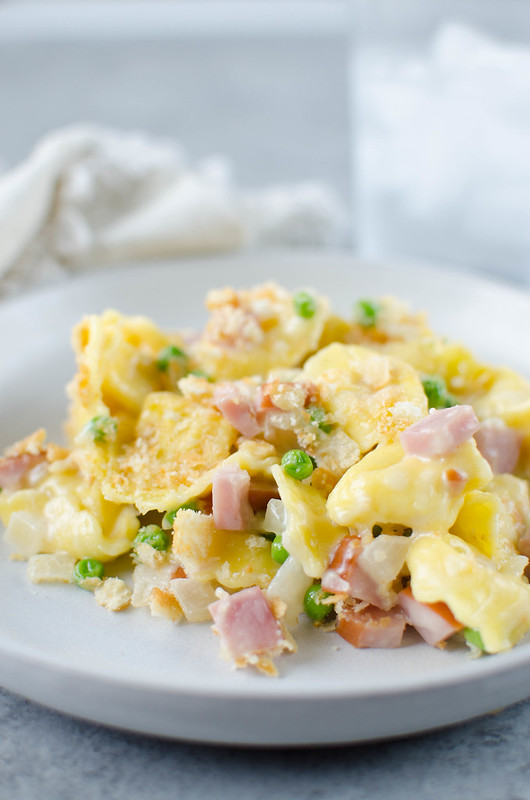 Cheesy Ham and Tortellini Bake - cheese-filled pasta with ham and peas in a creamy, cheesy sauce with a Ritz cracker topping! An easy 30 minute meal the whole family will love!