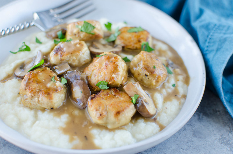 Paleo Chicken Marsala Meatballs - paleo meatballs in a delicious creamy mushroom sauce. Serve over mashed cauliflower for the perfect paleo comfort food!
