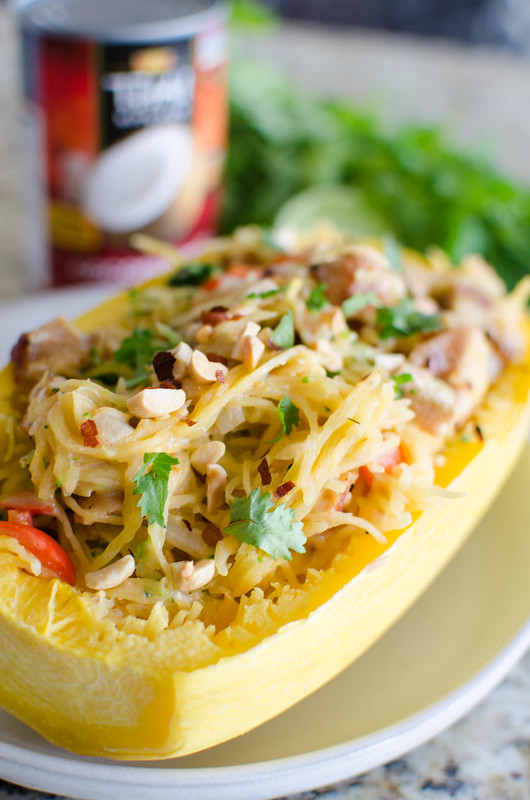 Thai Peanut Spaghetti Squash - chicken, broccoli, and bell peppers stuffed in a spaghetti squash and coated in a sweet and spicy, creamy peanut sauce. Low carb and dairy free! 