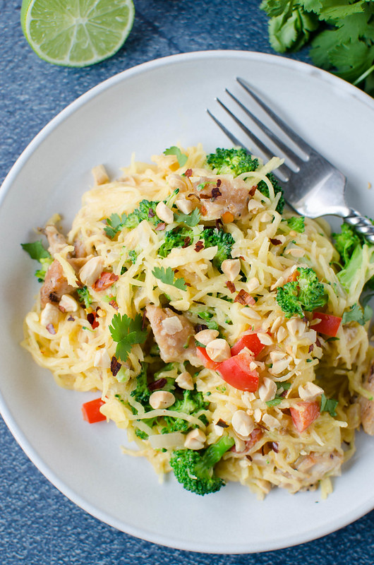 Thai Peanut Spaghetti Squash - chicken, broccoli, and bell peppers stuffed in a spaghetti squash and coated in a sweet and spicy, creamy peanut sauce. Low carb and dairy free! 