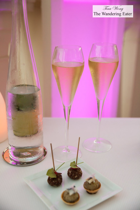 Amuse bouches of foie gras rolled in cocoa nibs and an anchovy tart and Champagne to start