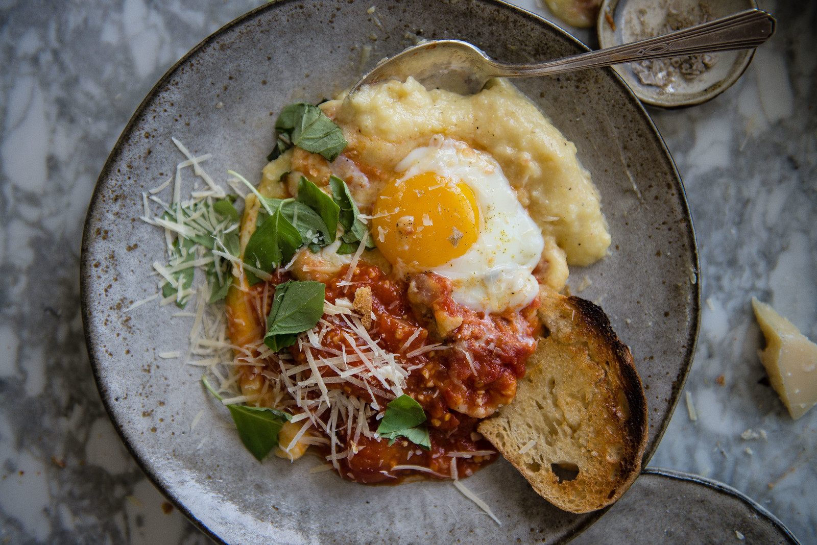 tomato-braised eggs and creamy baked polenta | two red bowls