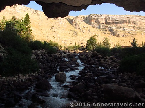 Looking out of the cave to the river and cliffs, Sinks Canyon State Park, Wyoming
