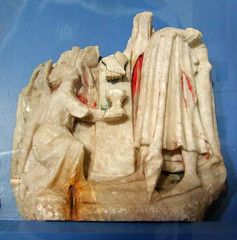 an angel collects Christ's precious blood in a chalice (14th Century English alabaster, fragment)